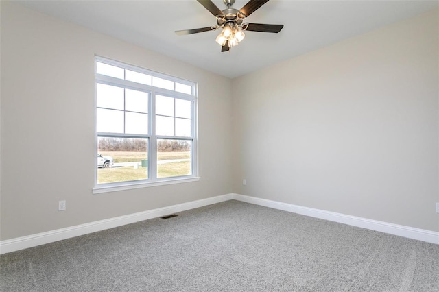 carpeted empty room with ceiling fan