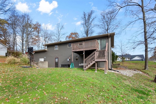 back of house with a yard and a deck