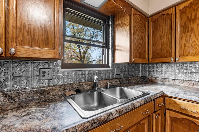 kitchen with tasteful backsplash and sink