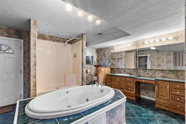 full bathroom with tile patterned flooring, separate shower and tub, a textured ceiling, toilet, and vanity