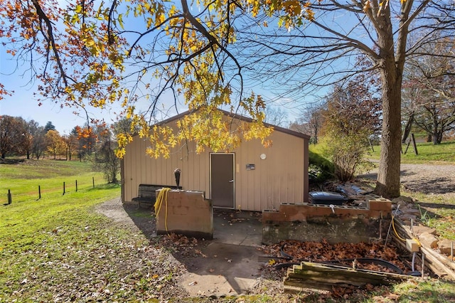 view of outdoor structure with a lawn