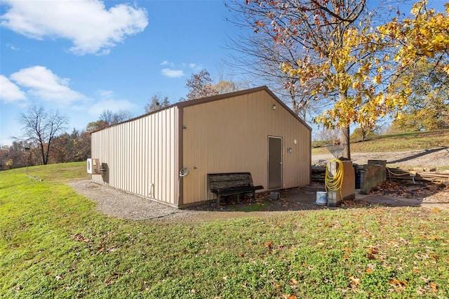 view of outdoor structure with a yard