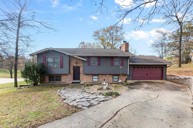 view of front of home with a garage and a front lawn