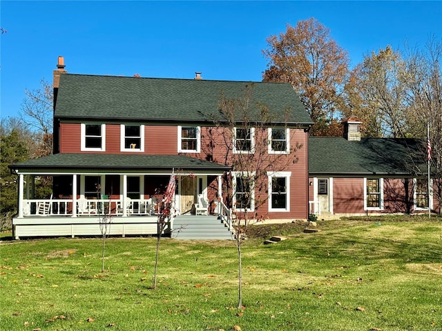 view of front of home featuring a front yard and a porch