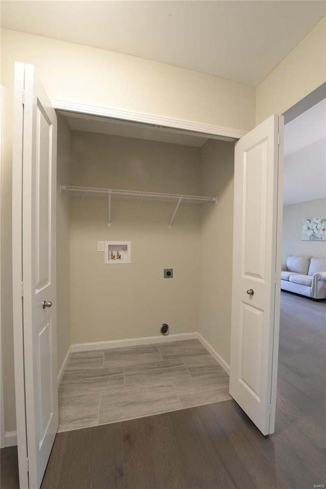 washroom featuring hookup for an electric dryer, dark wood-type flooring, and washer hookup