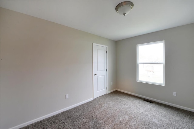 empty room featuring carpet floors