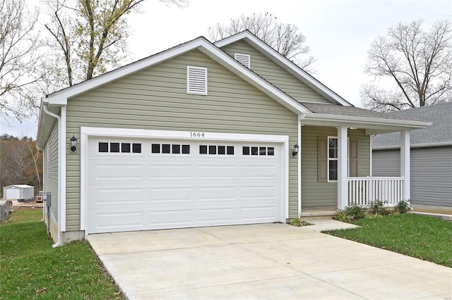 view of front of property featuring a porch and a garage