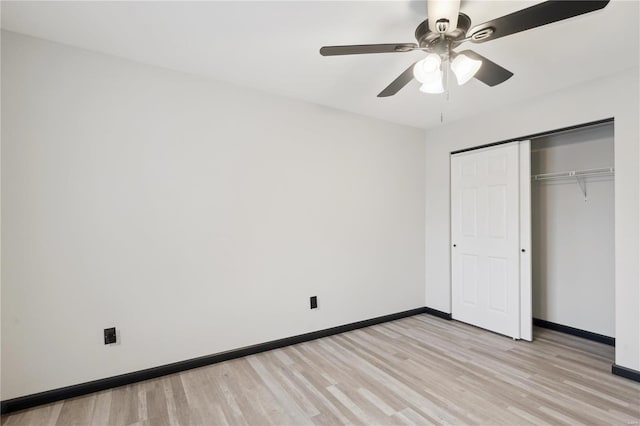 unfurnished bedroom featuring light hardwood / wood-style flooring, ceiling fan, and a closet