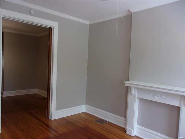 interior space featuring wood-type flooring and crown molding