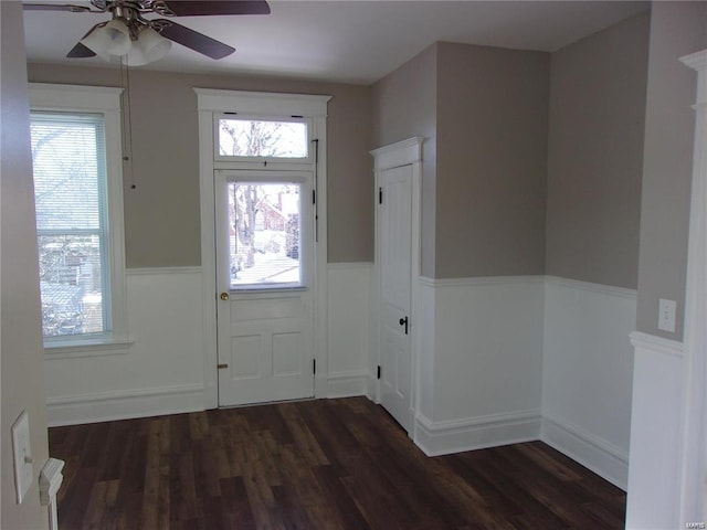 entryway with ceiling fan and dark hardwood / wood-style flooring