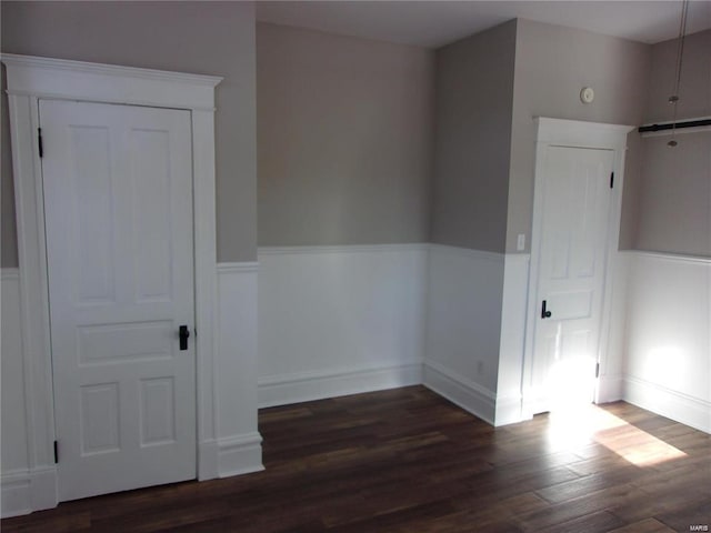 empty room featuring dark wood-type flooring