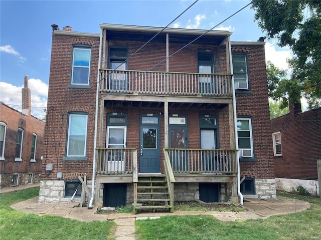 rear view of house with a balcony