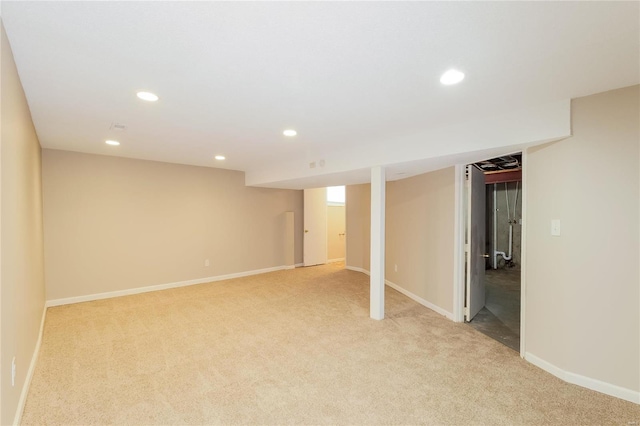 basement featuring light colored carpet