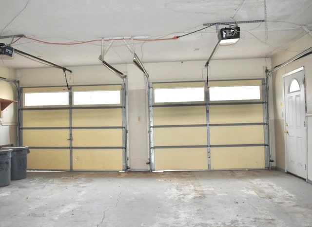 garage featuring a garage door opener