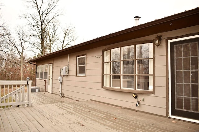 wooden deck with central air condition unit