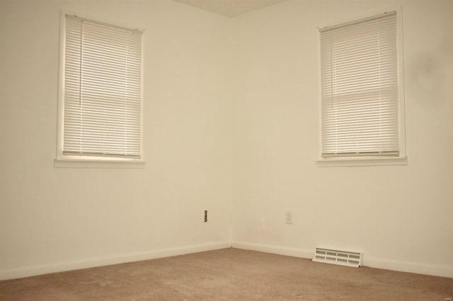 spare room with light colored carpet