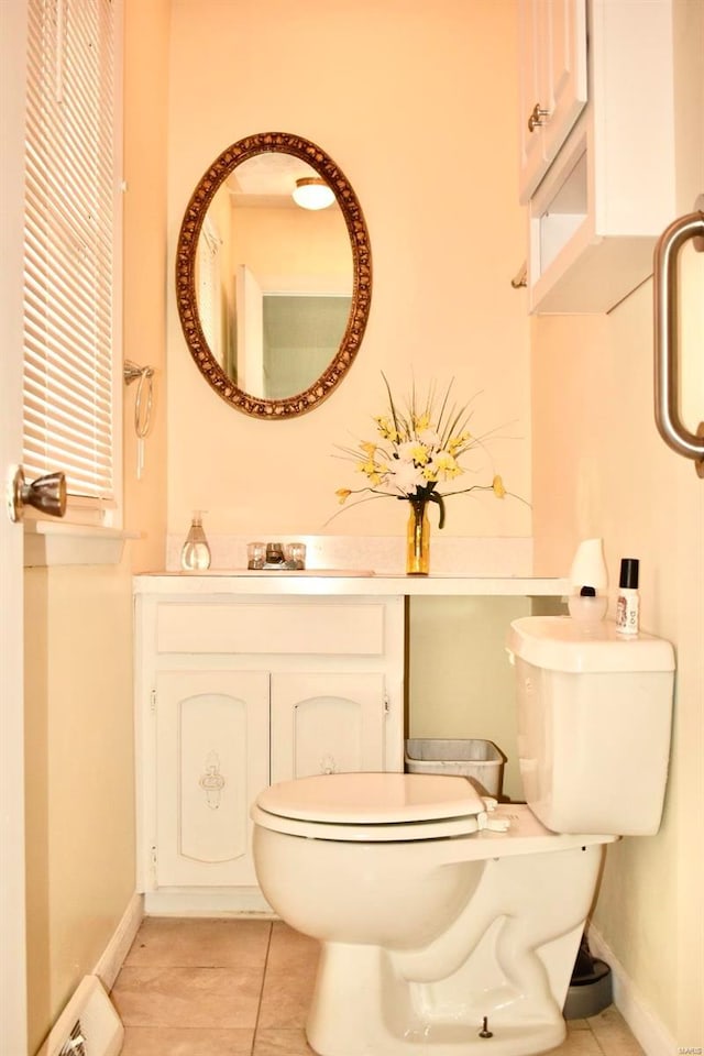 bathroom with tile patterned floors, sink, and toilet