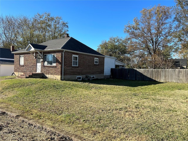 view of home's exterior featuring a lawn