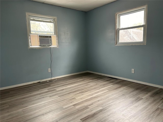 unfurnished room with light hardwood / wood-style floors