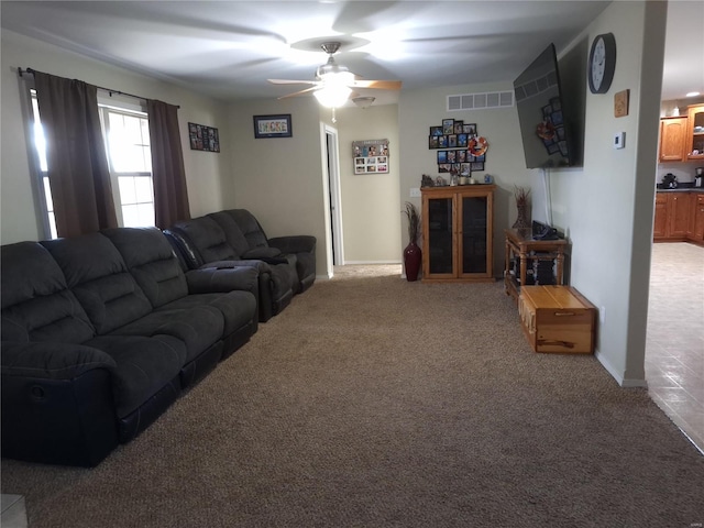 living room with light carpet and ceiling fan