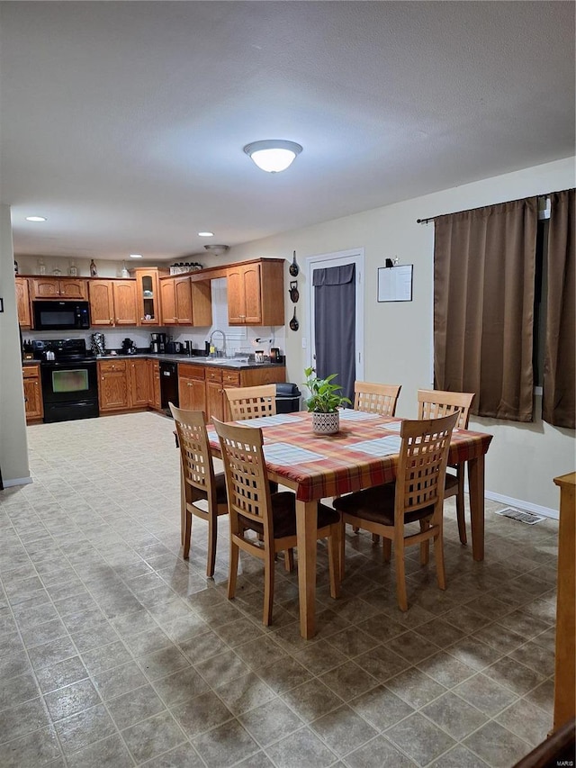 dining room featuring sink