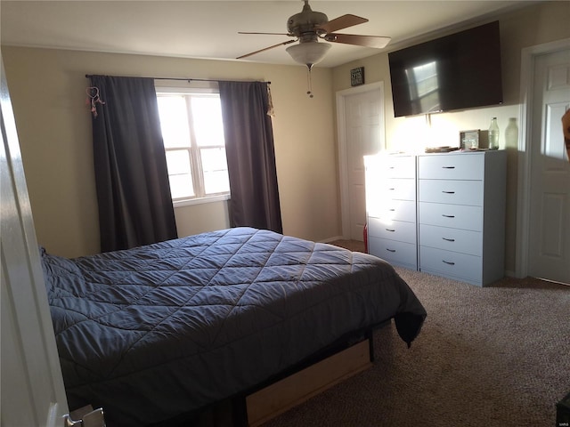 carpeted bedroom featuring ceiling fan