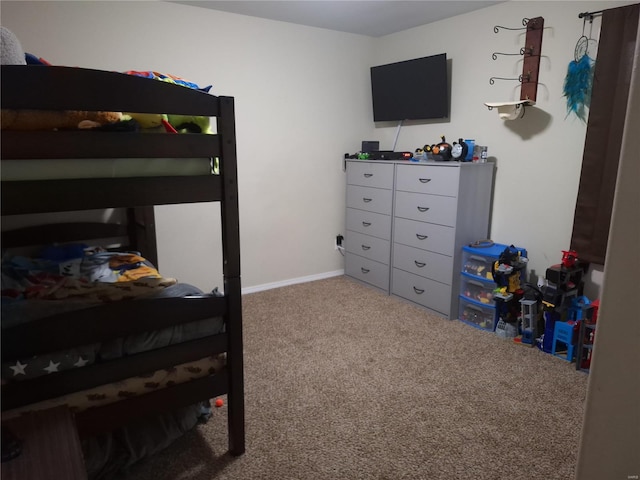 bedroom featuring light carpet