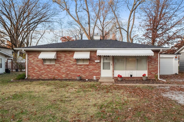 back of house with a yard