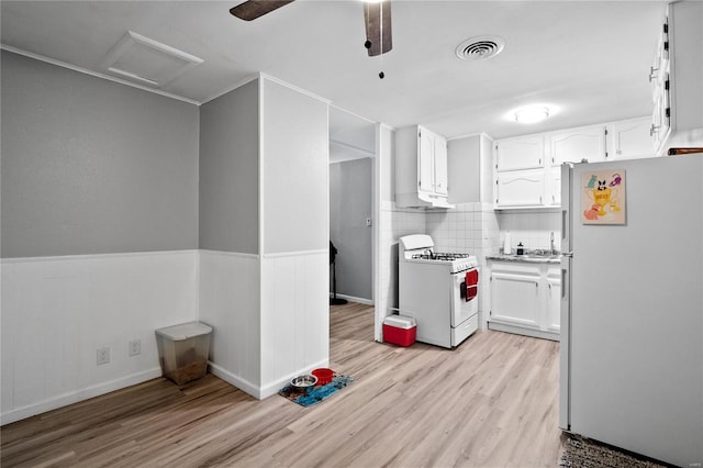 kitchen featuring white cabinetry, white appliances, backsplash, and light hardwood / wood-style flooring