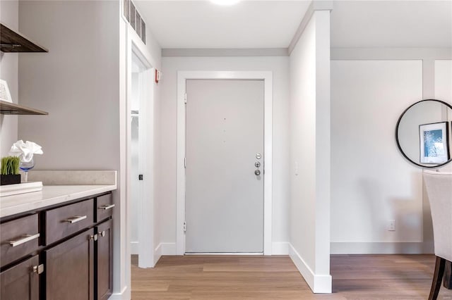 entryway with light wood-type flooring