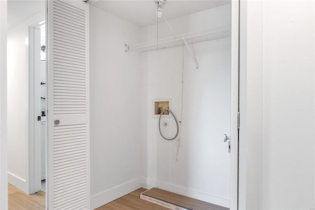 washroom featuring light hardwood / wood-style flooring and washer hookup