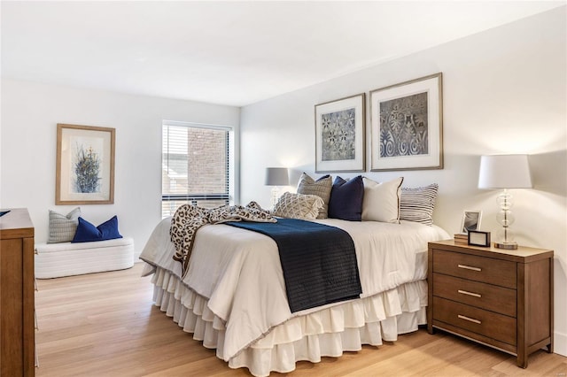 bedroom with light wood-type flooring