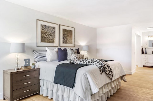 bedroom with light hardwood / wood-style floors