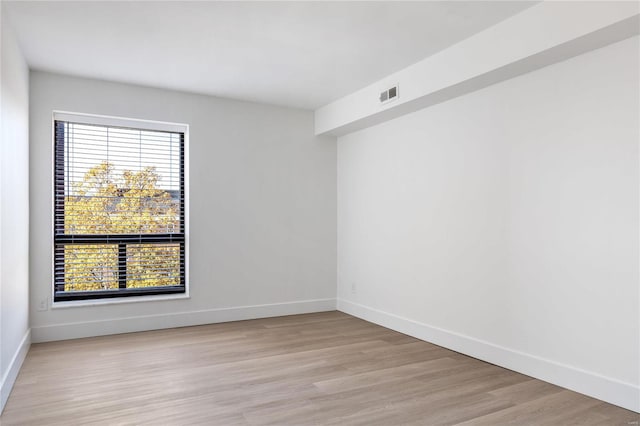 spare room featuring light hardwood / wood-style flooring