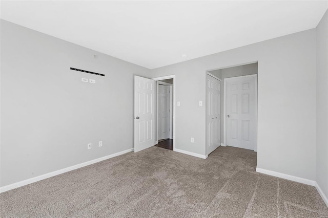 unfurnished bedroom featuring carpet flooring