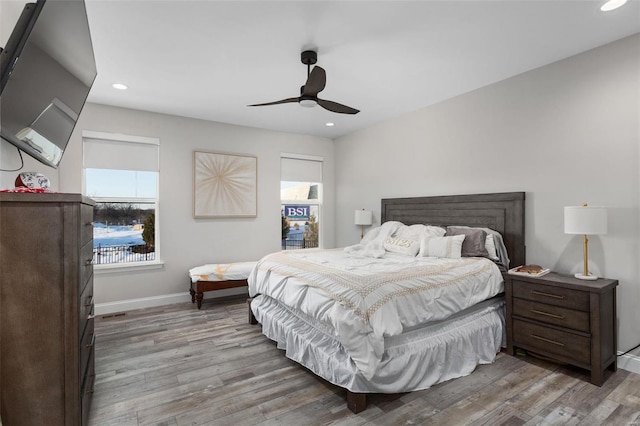 bedroom featuring ceiling fan and light wood-type flooring