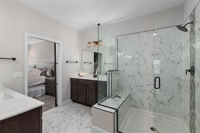 bathroom featuring an inviting chandelier, an enclosed shower, and vanity