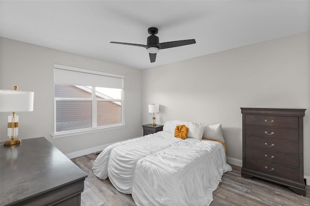 bedroom featuring ceiling fan and light hardwood / wood-style flooring