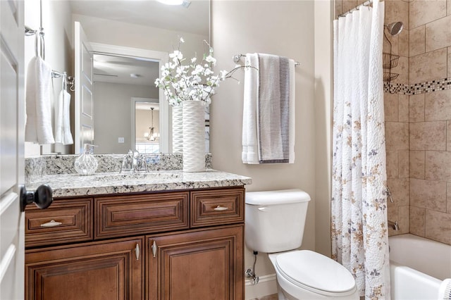 full bathroom with vanity, toilet, and shower / tub combo with curtain