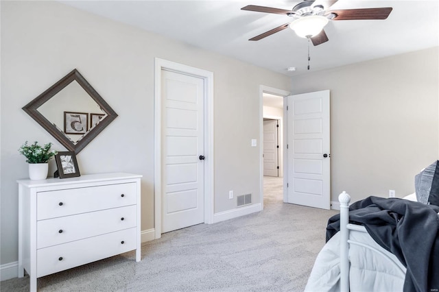 bedroom featuring ceiling fan and light colored carpet