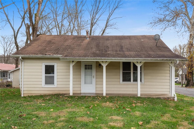 view of front of home with a front lawn and a porch