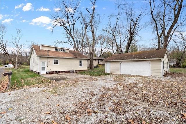 view of property exterior featuring a garage and an outdoor structure