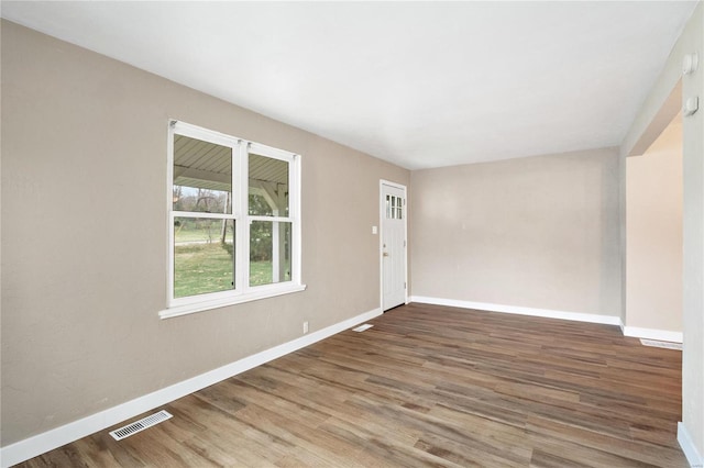 spare room with hardwood / wood-style flooring