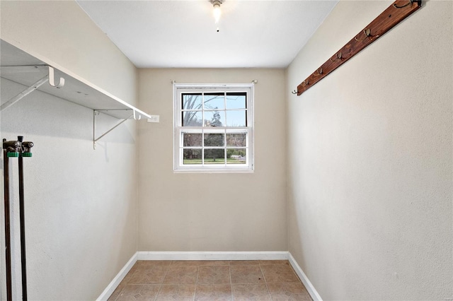 walk in closet featuring light tile patterned floors