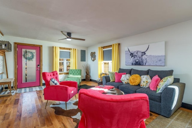 living room with hardwood / wood-style floors and ceiling fan