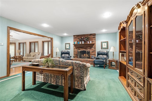 living room featuring carpet flooring and a fireplace