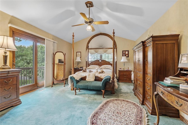 carpeted bedroom featuring access to exterior, vaulted ceiling, and ceiling fan