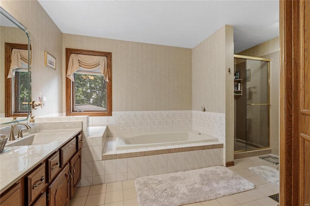 bathroom featuring tile patterned flooring, vanity, and separate shower and tub