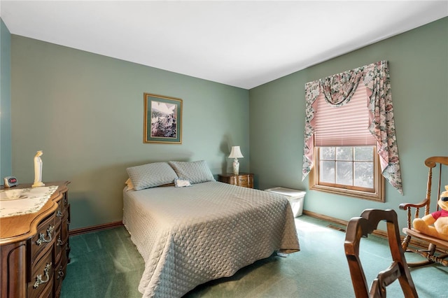 bedroom with dark colored carpet