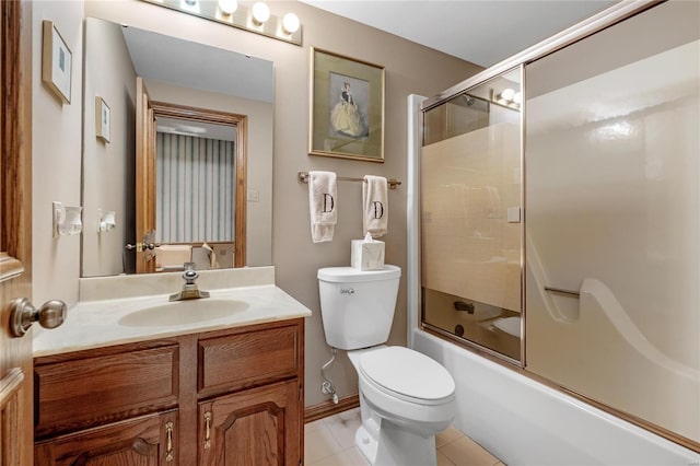 full bathroom with tile patterned flooring, vanity, toilet, and enclosed tub / shower combo